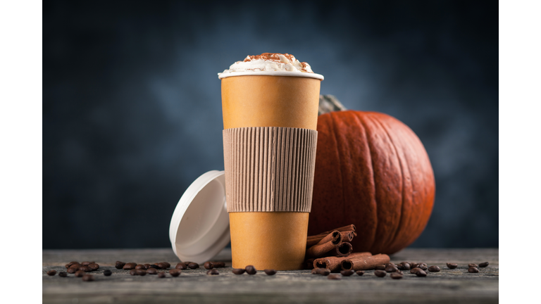 Pumpkin spice latte in a paper cup