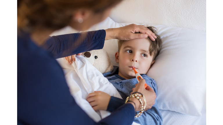 Boy measuring fever