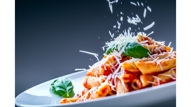Pasta Penne with Tomato Bolognese Sauce, Parmesan Cheese and Basil.