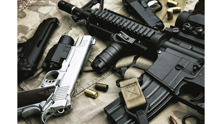 Weapons and military equipment for army, Assault rifle gun (M4A1) and pistol on camouflage background.