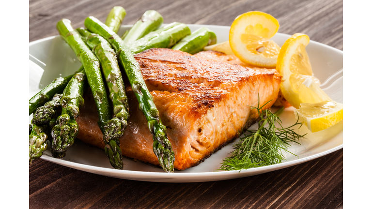 Grilled salmon with French fries and asparagus