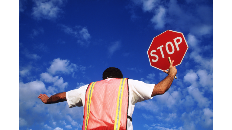 Crossing guard with stop sign