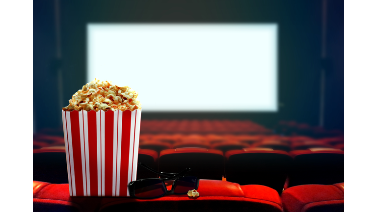 Cinema seat with popcorn and 3d glasses