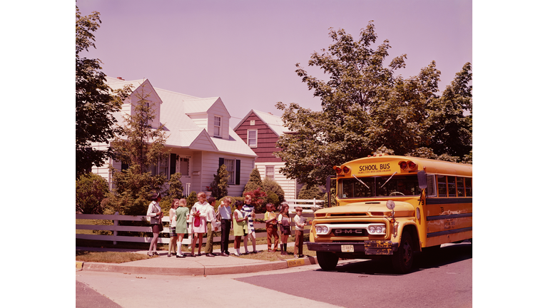 Students in line, waiting to board school bus. (Photo by H. Armstrong Roberts/Retrofile/Getty Images)