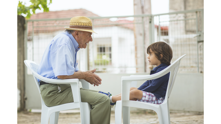 Portrait of a small boy with his grandfather