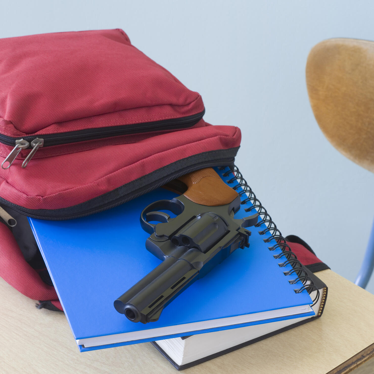 Backpack, notebooks, and handgun