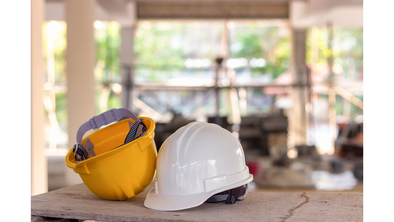 Close Up Of Hardhats On Table At Construction Site