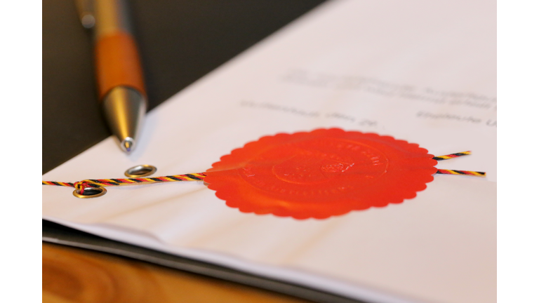 Notarized agreement with red official seal (Germany)