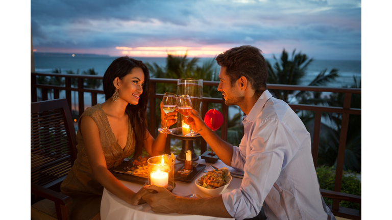 couple enjoying a romantic dinner by candlelight