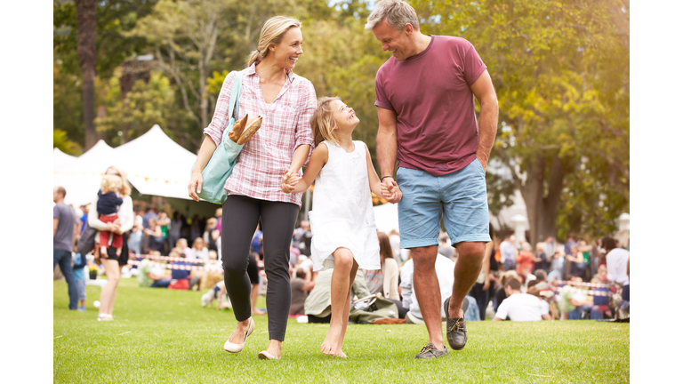 Family Relaxing At Outdoor Summer Event