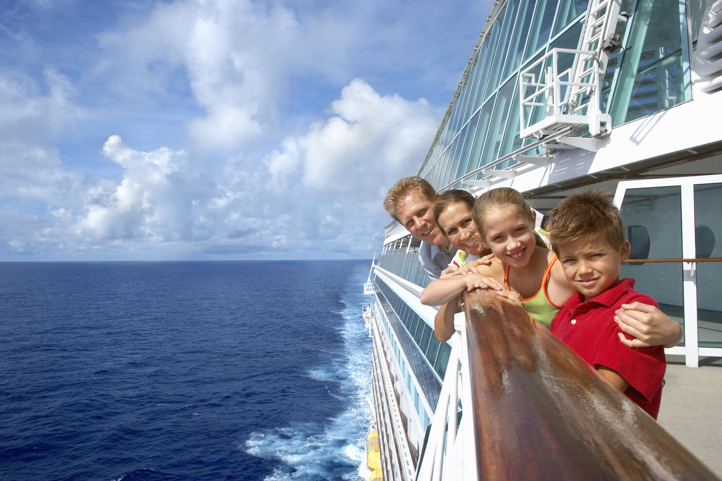 Mother and father with children (10-12) on cruise ship