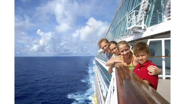 Mother and father with children (10-12) on cruise ship