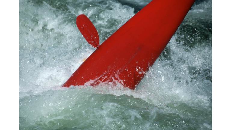 Kayak Overturned in Whitewater Rapids
