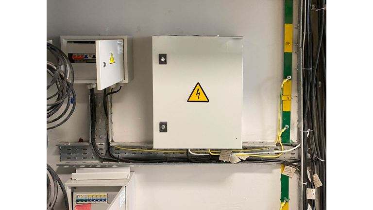 Introductory machine and electric energy meter in a dashboard on a pole on a land plot