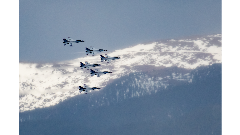 USAF Academy graduation - Over Pikes Peak USAF Thunderbirds, F-16 fighter jets perform precision maneuvers as a team