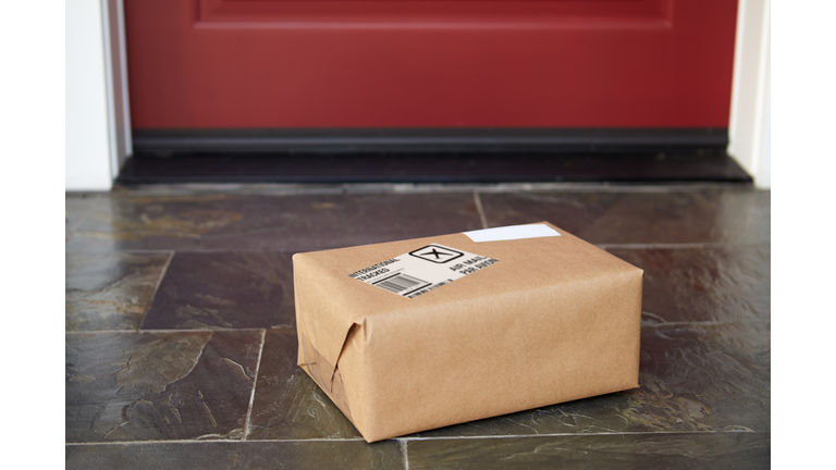 Close Up Of Parcel Delivery Outside Front Door