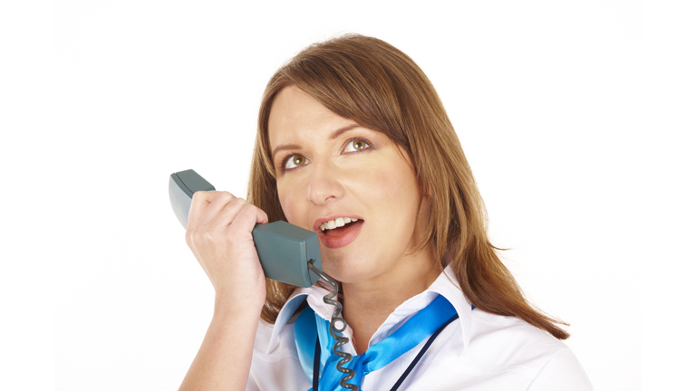 Beautiful flight attendant or stewardess talking on intercom