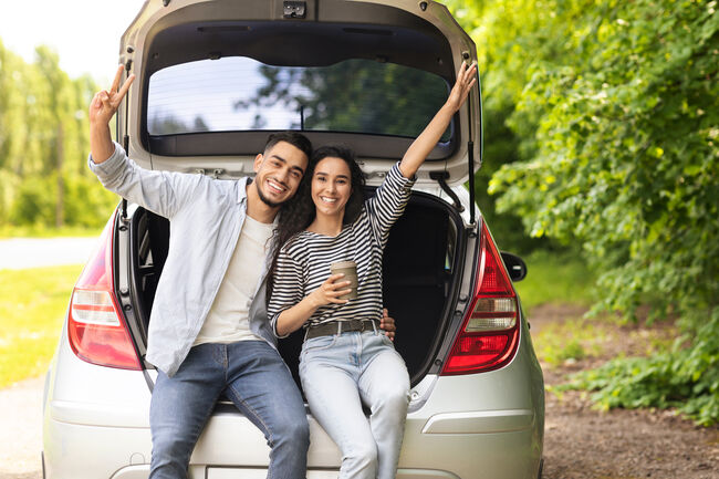 Emotional middle-eastern couple drinking coffee at country side