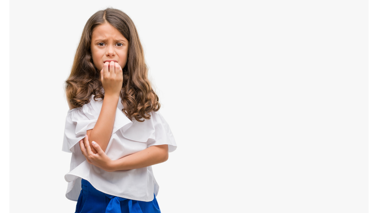 Brunette hispanic girl looking stressed and nervous with hands on mouth biting nails. Anxiety problem.