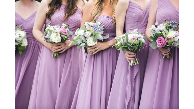 Close up of bridal party with floral bouquets