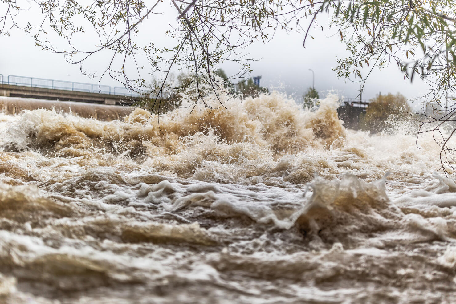 Flooded river during persistent heavy rain.