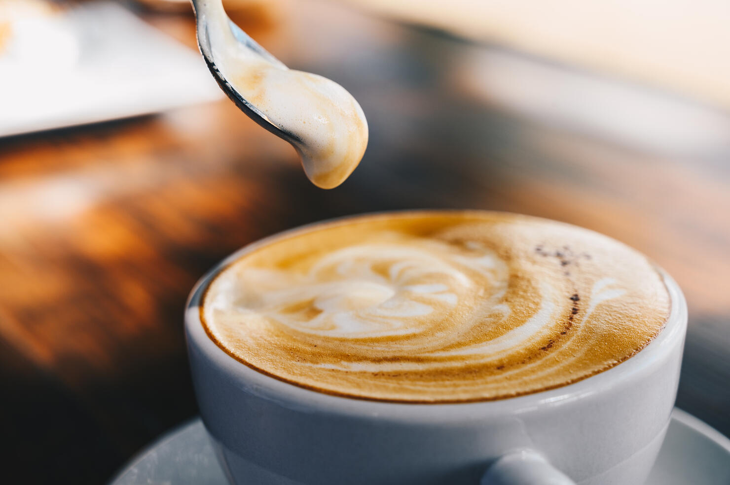 Close up of creamy surface of hot latte coffee.