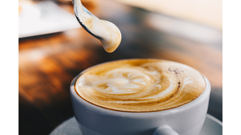 Close up of creamy surface of hot latte coffee.