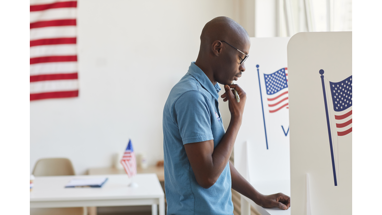 African-American Man in Voting Booth