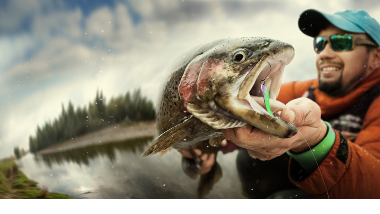 Fishing. Fisherman and trout. Dramatic.