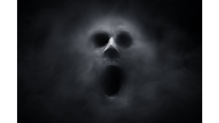 Scary ghost on dark background