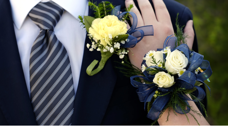Hands of date Prom night flowers corsage formal wear hand on shoulder