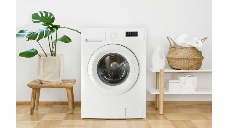 Clothes washing machine in laundry room interior