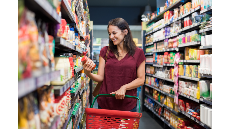 Smiling woman at supermarket