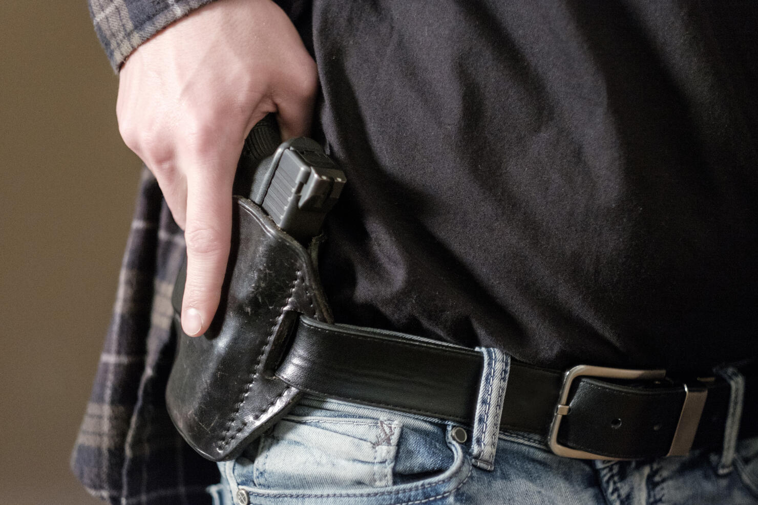 Man with Handgun in Holster