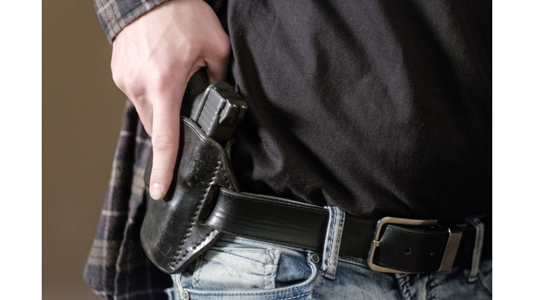 Man with Handgun in Holster