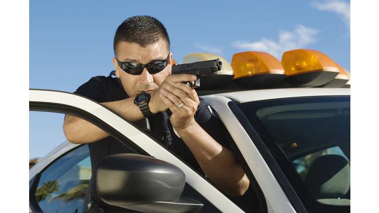 Officer Aiming With Short Gun