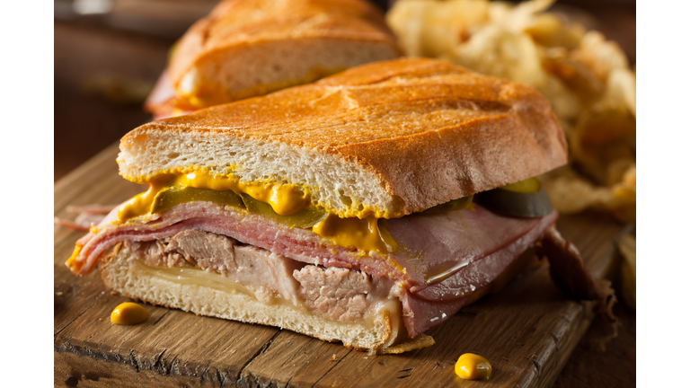 Close-up of a homemade Cuban sandwich on a wooden board