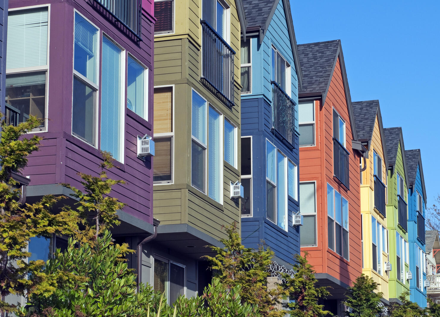 Row of new houses painted various colors in Seattle WA