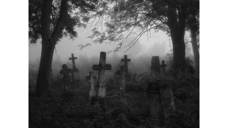 Crosses and graves in the old abandoned cemetery.
