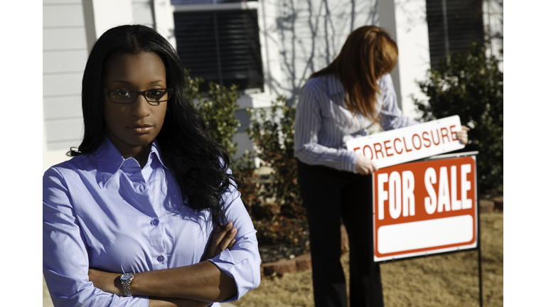 Upset Woman Outside Home Being Foreclosed On