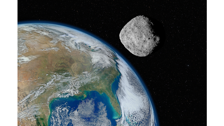 Asteroid approaching planet Earth, elements of this image furnished by NASA