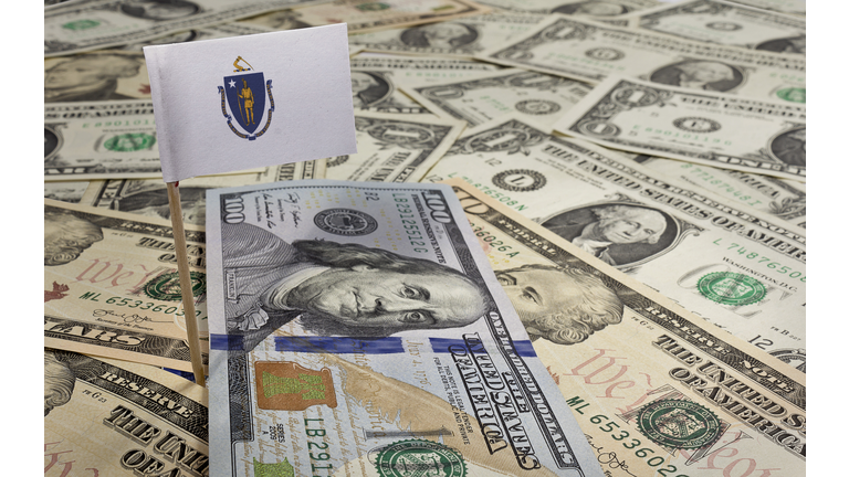 Flag of Massachusetts sticking in various american banknotes.(se