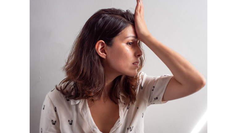 Young Woman Looks Like she Forgot to do Something