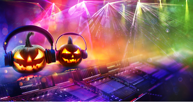 Halloween Disco Music - Pumpkins With Headphones In Nightclub With Confetti And Defocused Abstract Lights