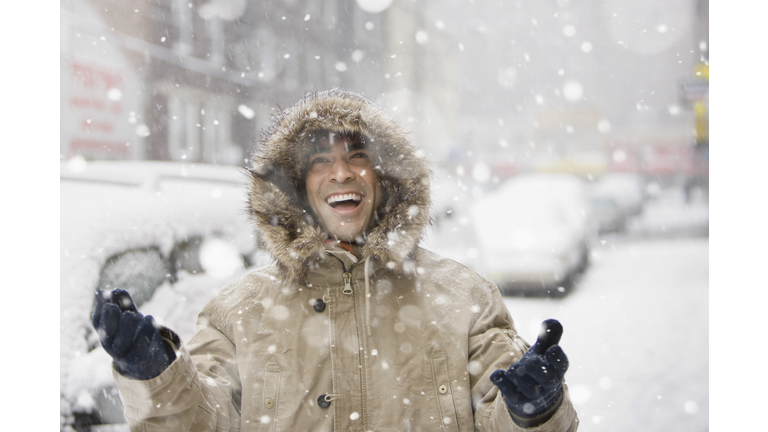 Man enjoying snow in city