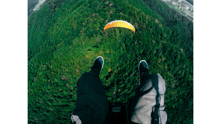 Low Section Of Men Paragliding
