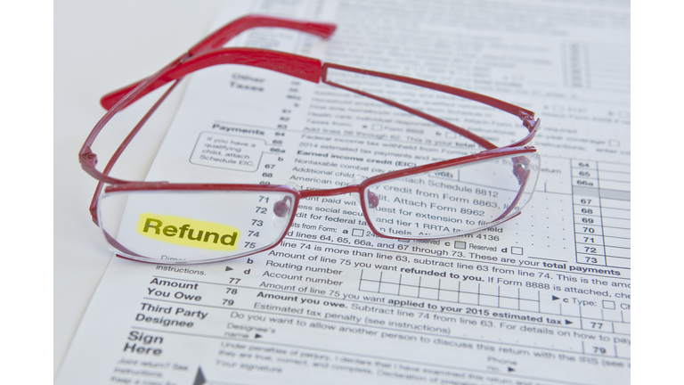Tax form and eyeglasses