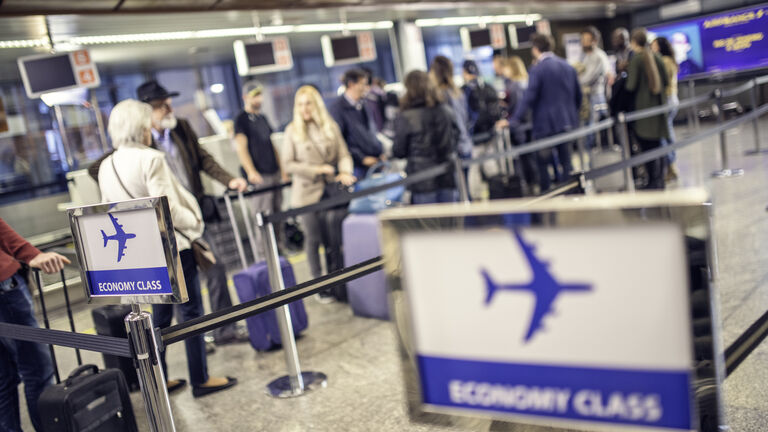 Airline passengers waiting in line