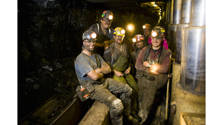 Coal miners smiling, portrait