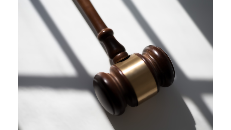 judge’s traditional wooden gavel on white background & shadow detail